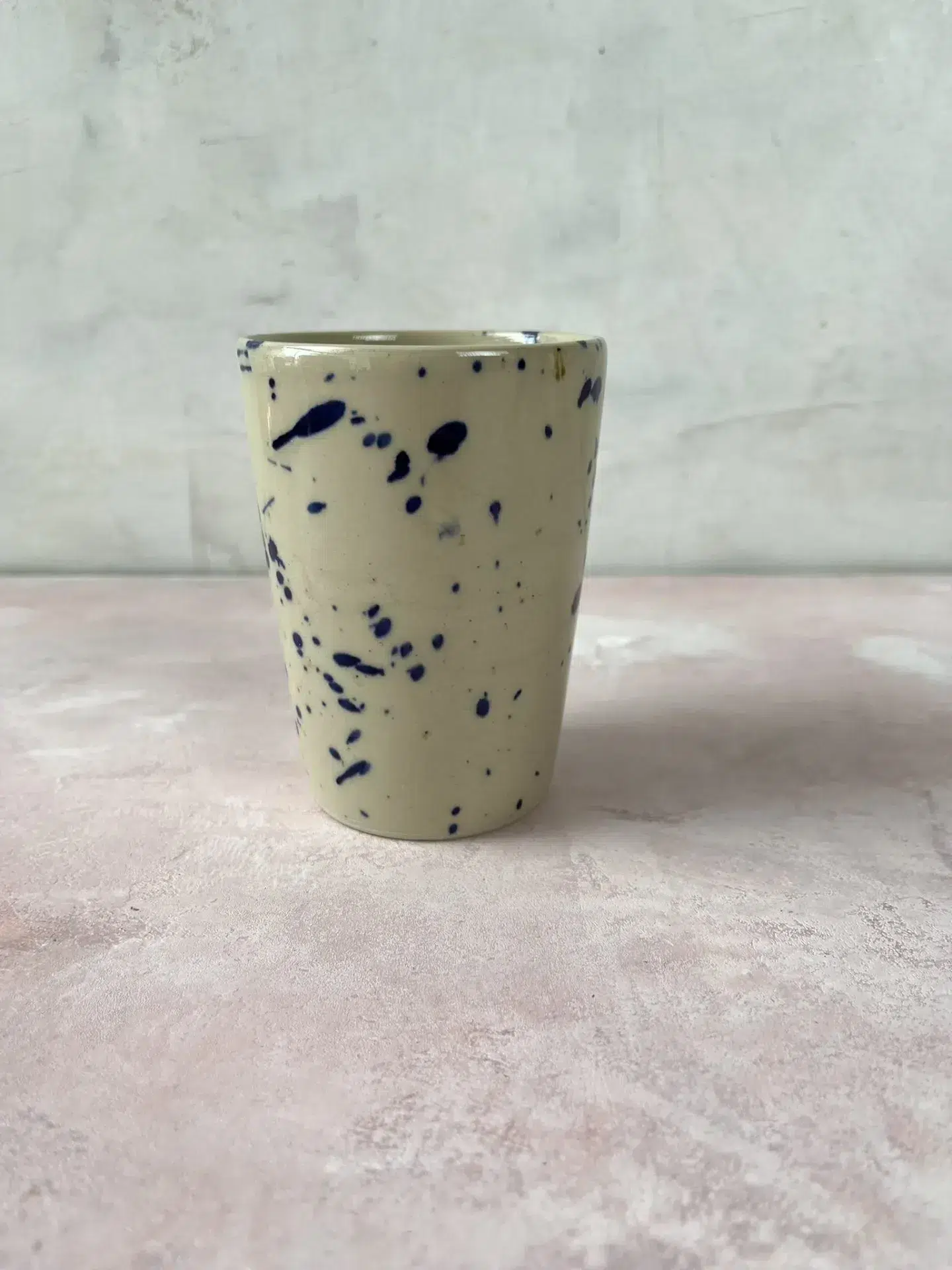 ceramic cup without handle - tall island cup Bornholm ceramic factory cream with blue splash