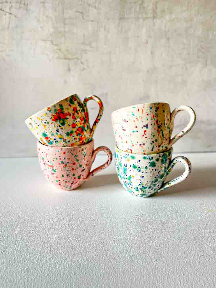 ceramic cup with handle in white with splash