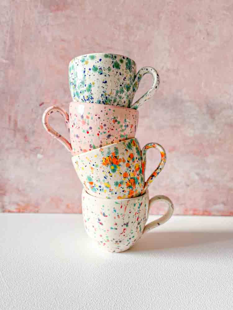 ceramic cup with handle in white with splash