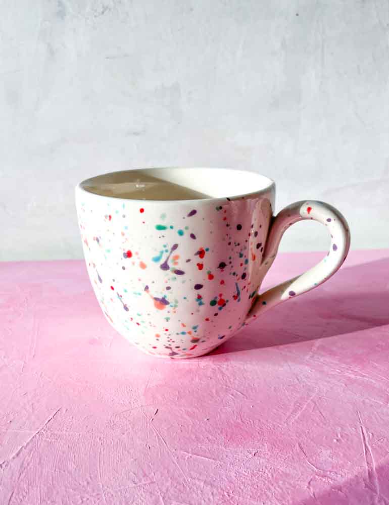 ceramic cup with handle in white with splash