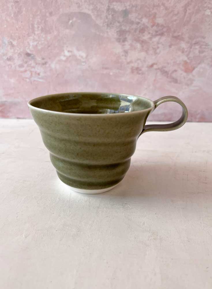 rikke mangelsen ceramics, porcelain cup olive, coffee cup, cup, pastel-colored cup, coffee cup, tea cup, handmade ceramics, cups with handle, made in denmark, danish design, remix by sofie, drill cover