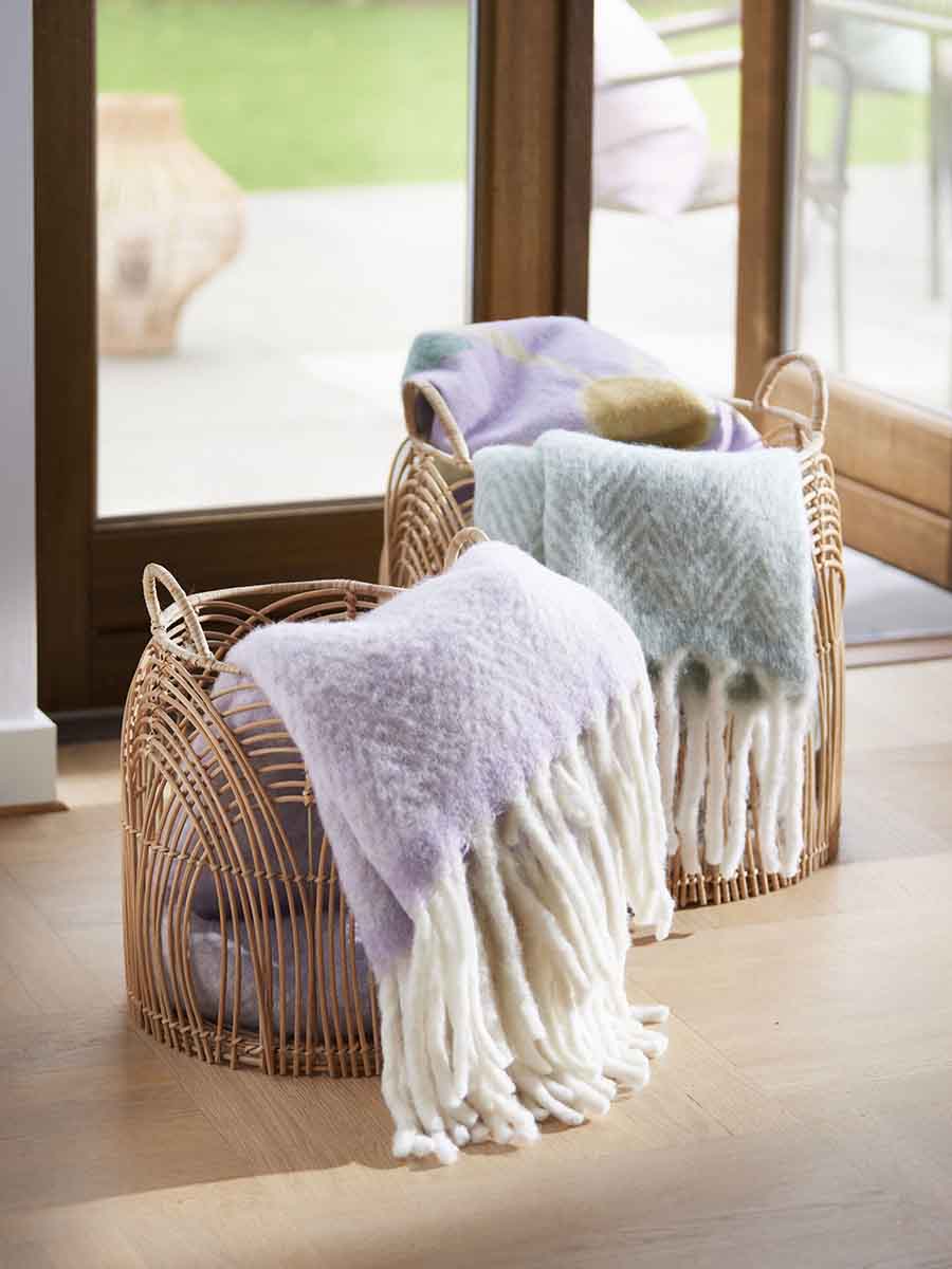 wool blankets from cozy living in light purple and mint green