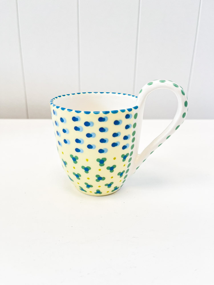 a cup with a handle in stoneware from potter's work