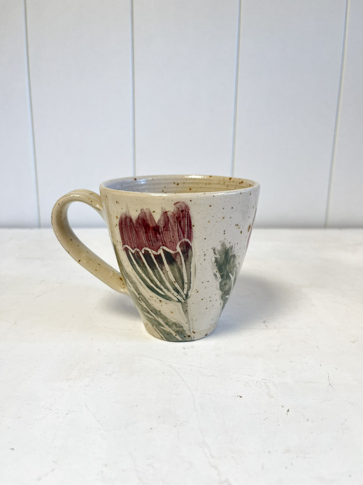 Cup with handles and floral motifs