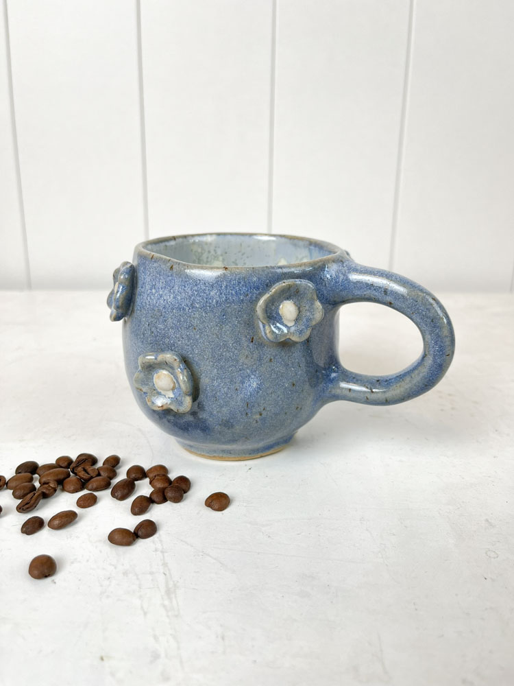 handmade ceramic cup with handles and flowers in pink at Remix by Sofie in Copenhagen.