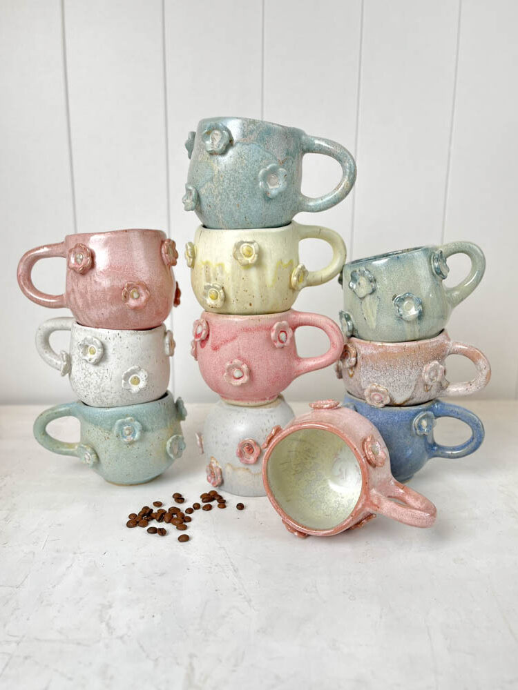handmade ceramic cup with handles and flowers in pink at Remix by Sofie in Copenhagen.