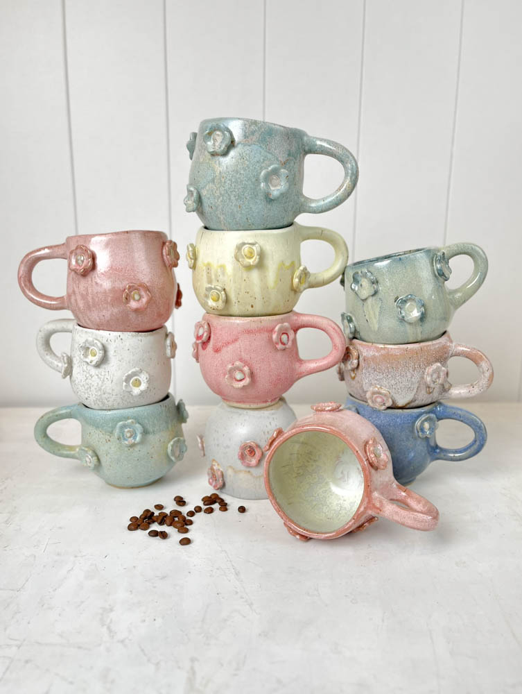 handmade ceramic cup with handles and flowers in pink at Remix by Sofie in Copenhagen.