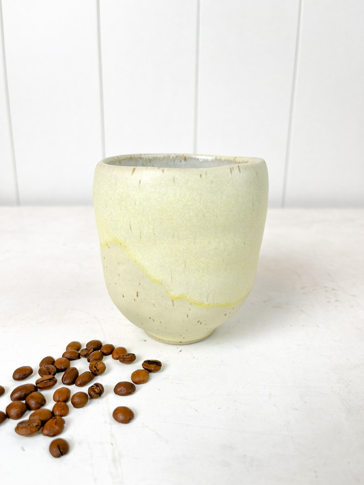 remix by sofie giant selection of handmade cups - here a ceramic cup without a handle in light yellow.