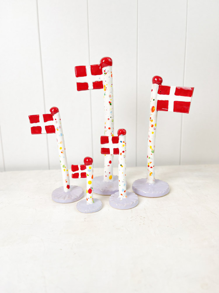 handmade ceramic flag from the clay play in harlequin flag with purple base