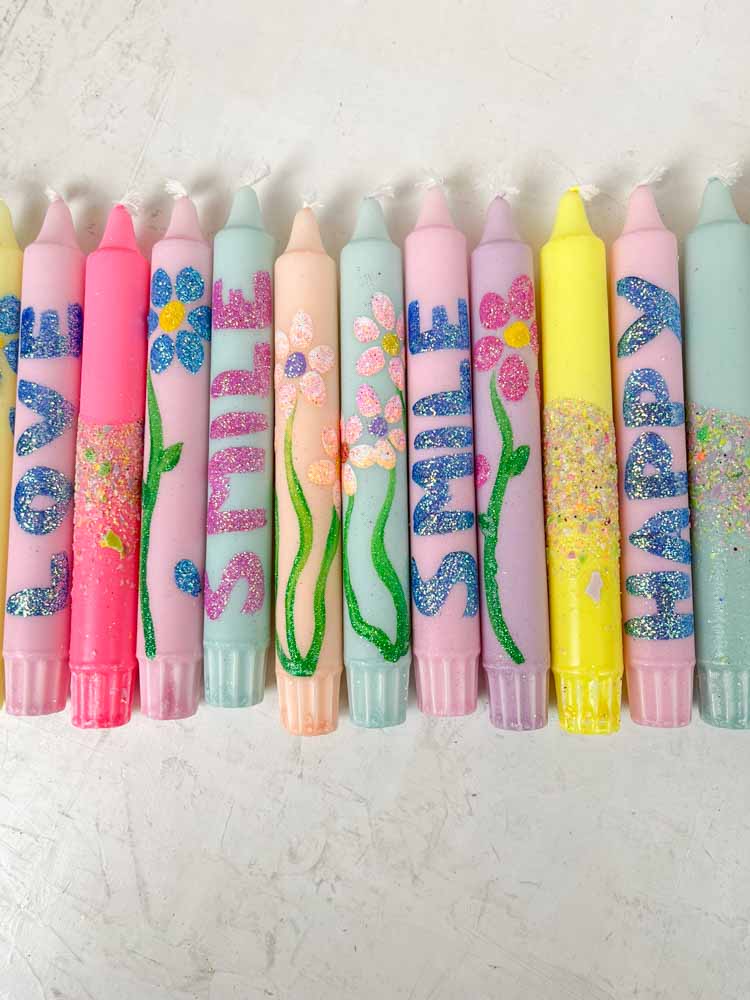 hand-painted candles in candlesticks with flowers and confetti - ahnelight