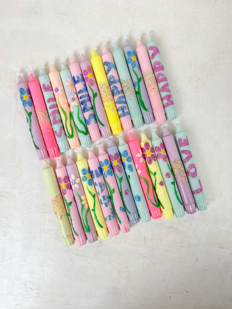 hand-painted candles in candlesticks with flowers and confetti - ahnelight