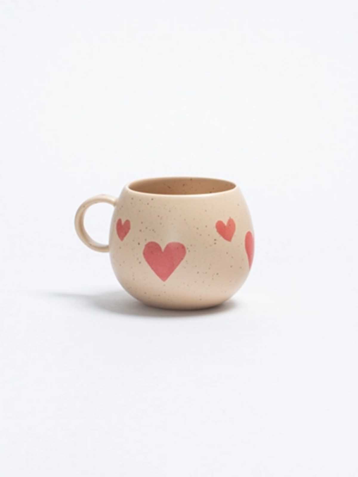 Egg back home, stoneware cups with red hearts at remix by Sofia