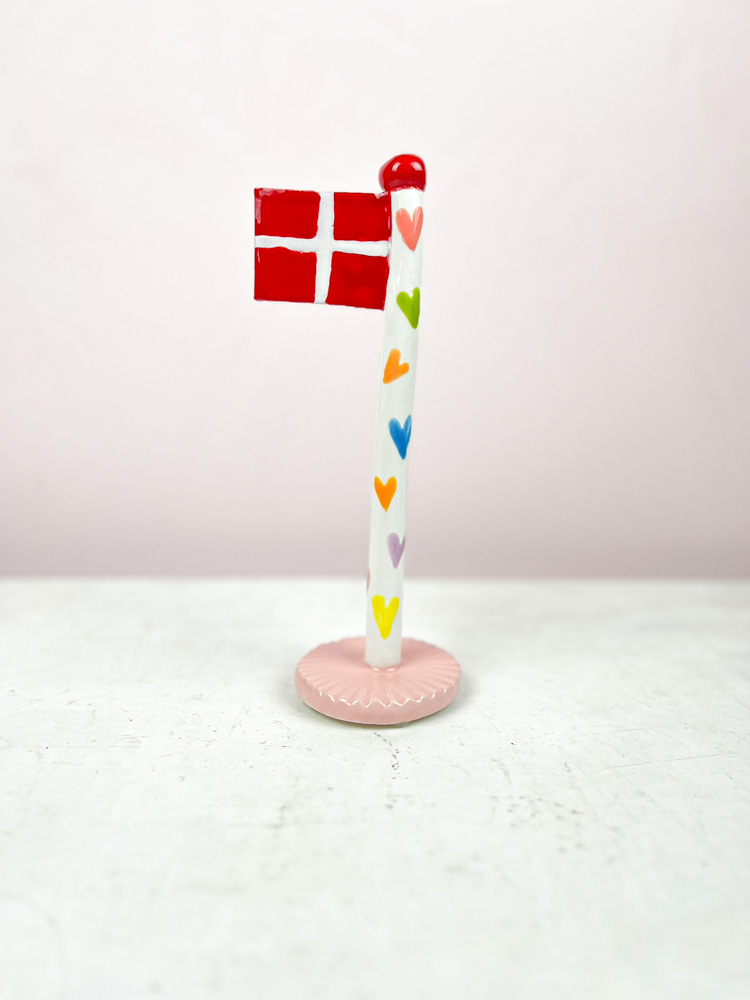 ceramic birthday flags from the clay game with a heart on the flagstick