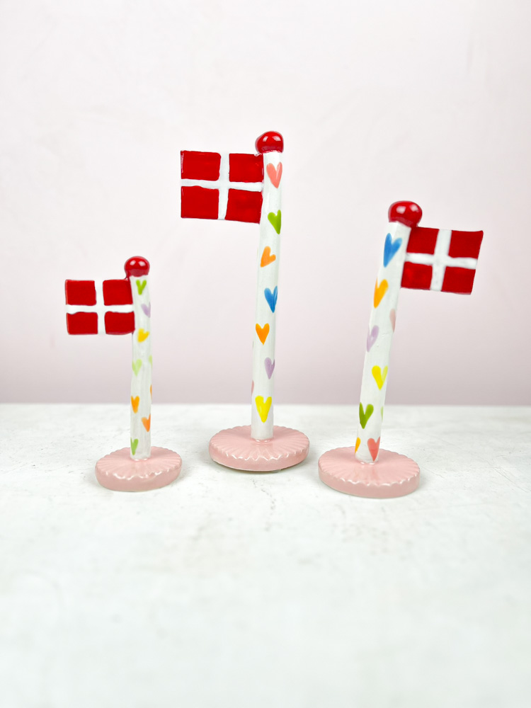 ceramic birthday flags from the clay game with a heart on the flagstick