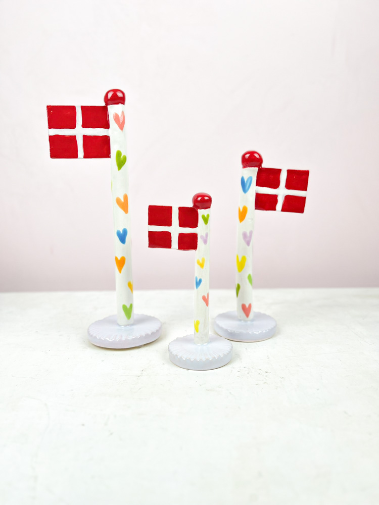 ceramic birthday flags from the clay game with a heart on the flagstick