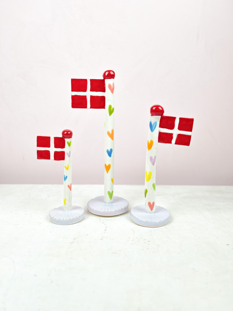 ceramic birthday flags from the clay game with a heart on the flagstick