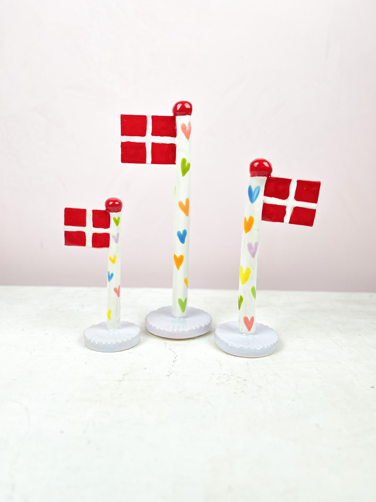 ceramic birthday flags from the clay game with a heart on the flagstick