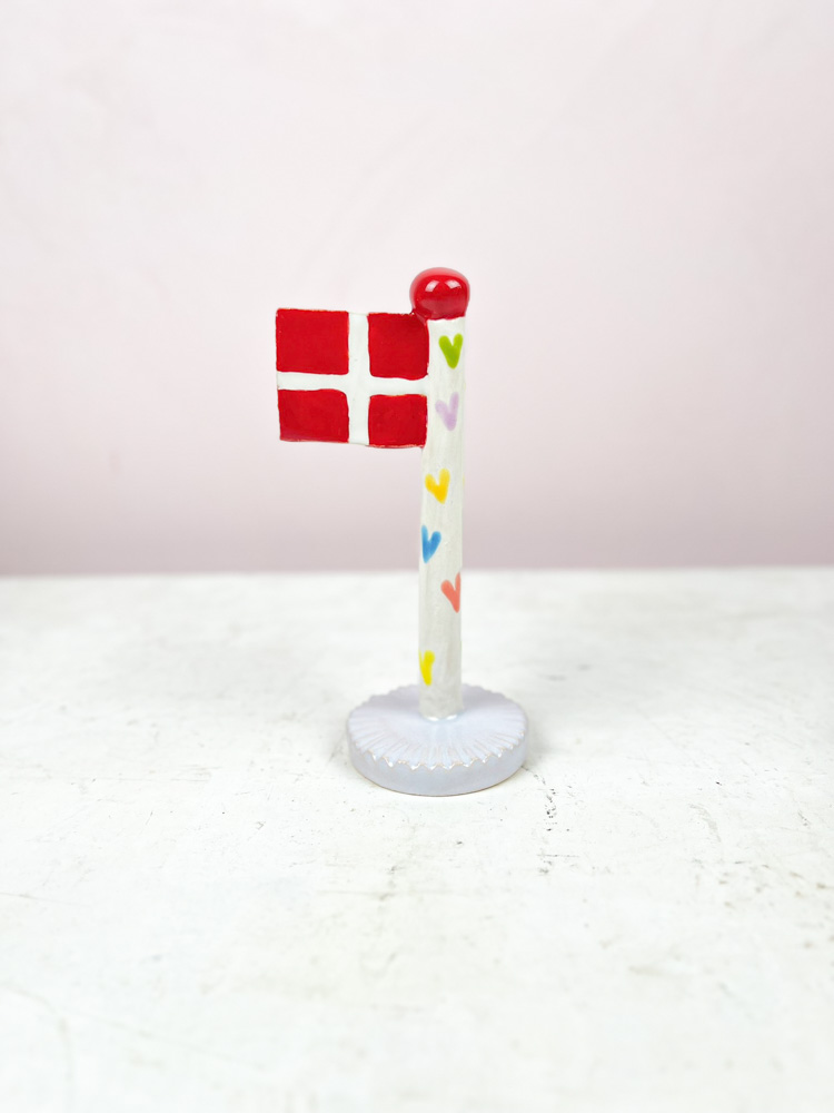 ceramic birthday flags from the clay game with a heart on the flagstick