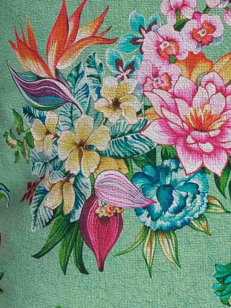 cushion outdoors with flowers in mint green