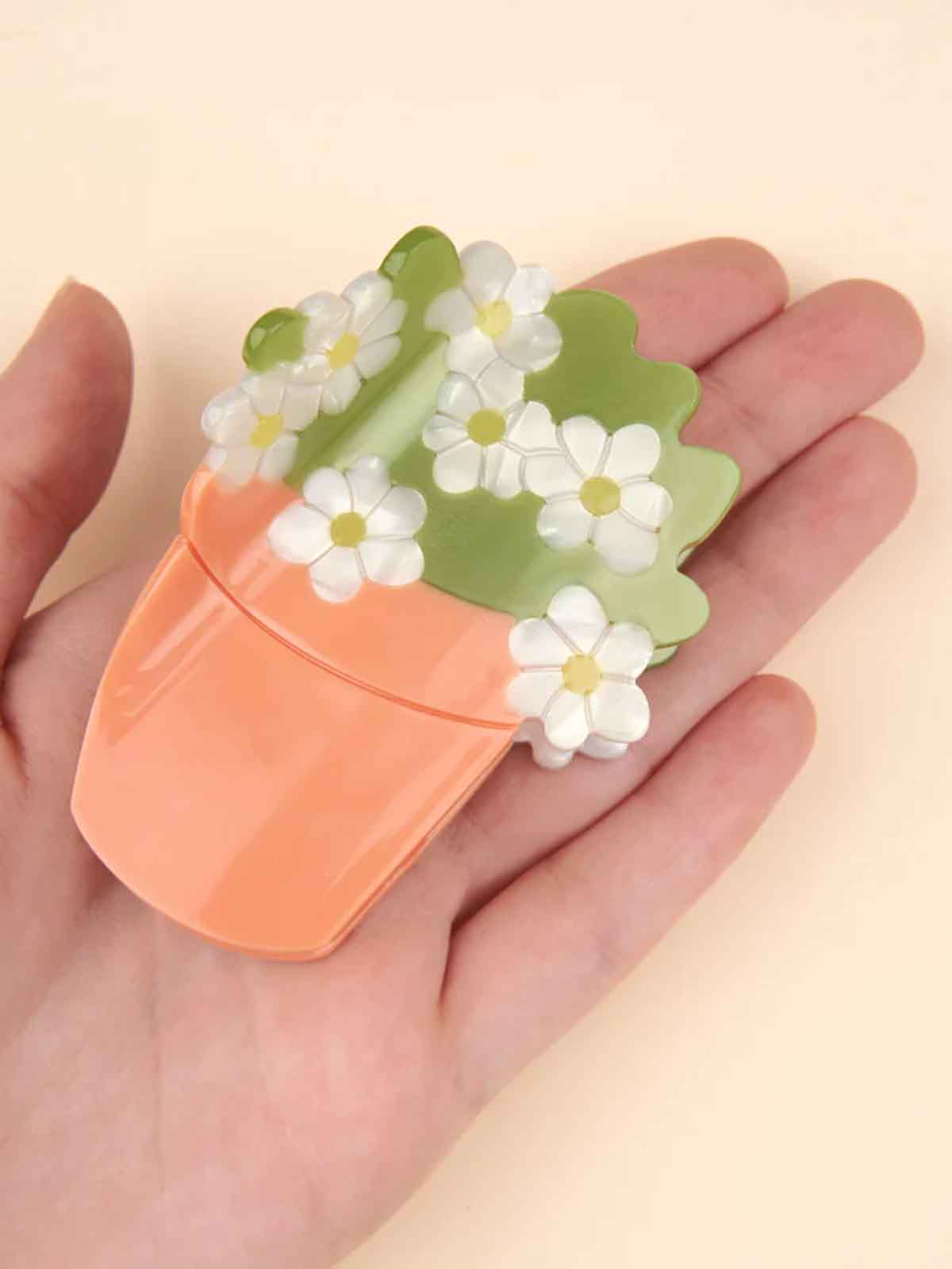 cou cou suzette hair clippings flowerpot with white flowers
