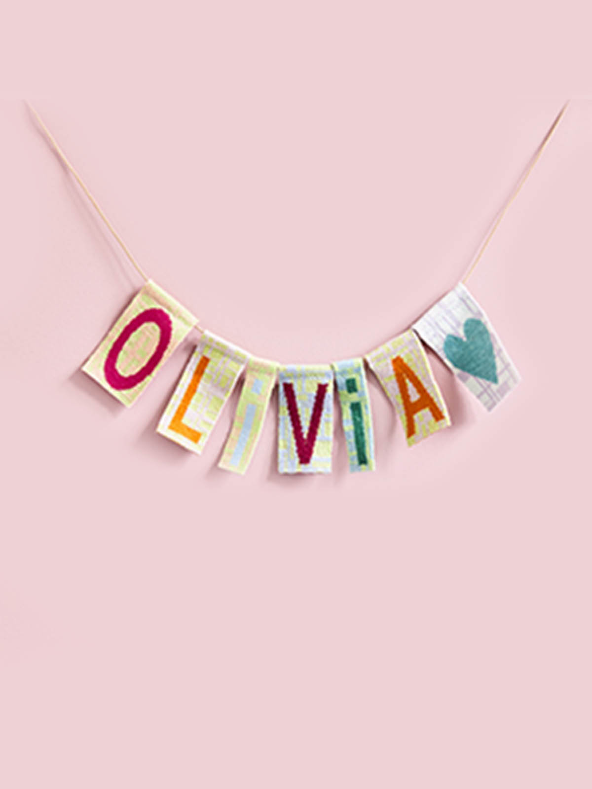 Linear animal garlands with recycled yarn letters