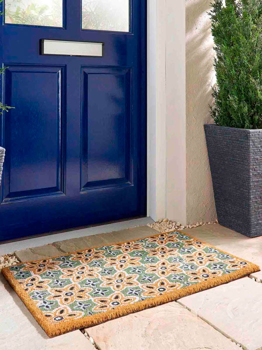 doormat with green and gold pattern
