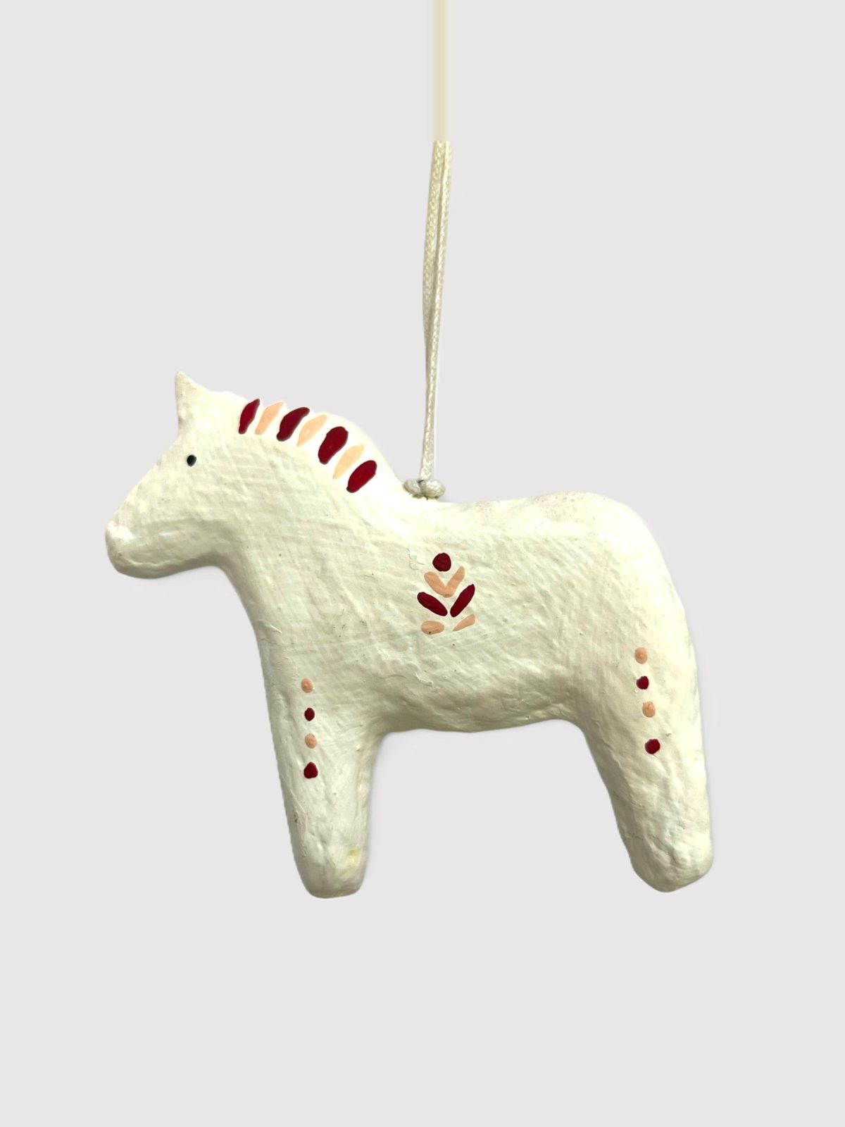 Alternative view of Dalahest in cotton maché – red pattern